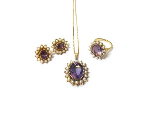 A 9ct gold, amethyst and cultured pearl set oval pendant, mounted with the oval cut amethyst at the centre, within a surround of cultured pearls, on a