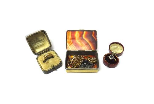 A gold and platinum, sapphire and diamond set cluster ring, claw set with the oval cut sapphire at the centre, within a surround of eight circular cut