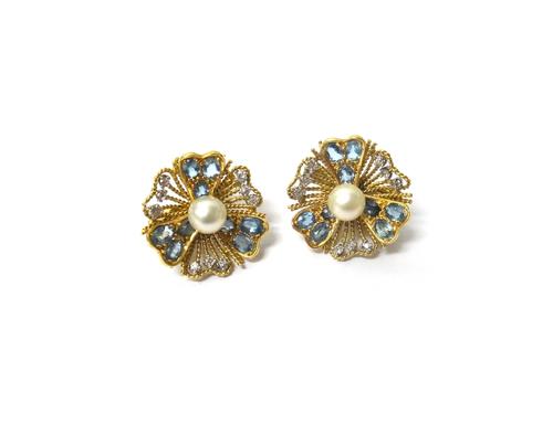 A pair of 18ct gold, aquamarine, diamond and cultured pearl set earclips, each designed as a flowerhead centred by a cultured pearl, London 1985, case