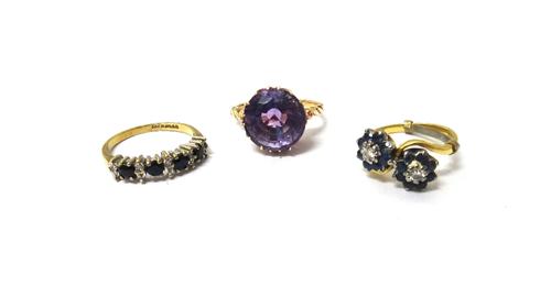 An 18ct gold, sapphire and diamond set ring, in a twin cluster crossover design, a 9ct gold, sapphire and diamond set half hoop ring and a gold ring,