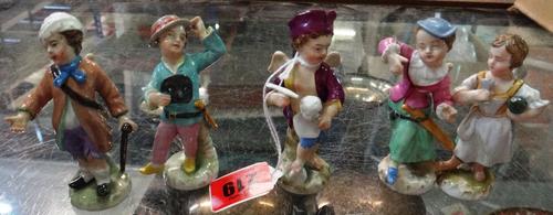 A set of five K.P.M Berlin porcelain figures, early 20th century, each with wings to the rear, in period dress on naturalistic bases, blue printed mar