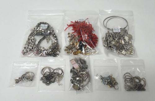 Silver and other jewellery, comprising; a charm bracelet, a Cred chain link bracelet of bicycle chain linkage, two further bracelets, a faceted curb l