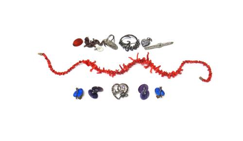 A Bohemian garnet set brooch, designed as a lizard, a white gold and green gem set brooch, two further brooches, a colourless paste set heart shaped p