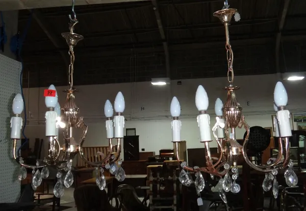 A pair of 20th century brass five branch chandeliers.