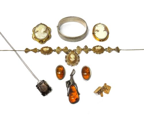 A gold mounted oval shell cameo brooch, carved as the portrait of a lady, a gilt metal mounted oval shell cameo brooch, a gilt filigree and shell came