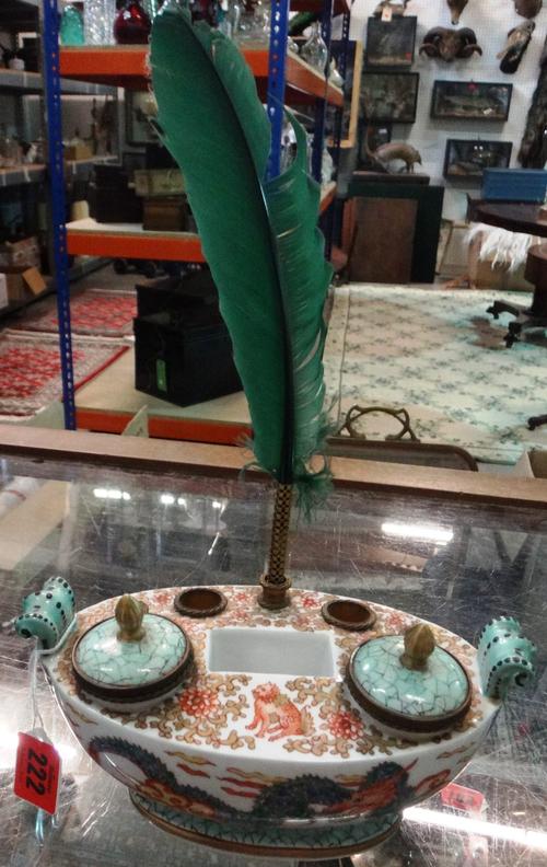 A Chantilly style porcelain encrier, 20th century, decorated in the Chinese taste with dragons chasing a flaming pearl against a gilt green foliate gr