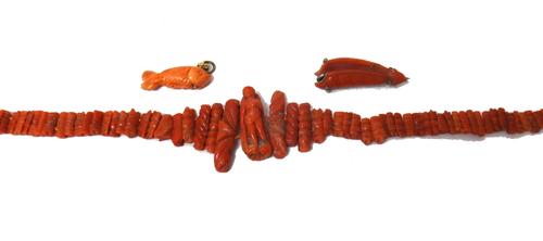 A carved coral necklace, the front with a standing figure motif, between graduated carved sides and on a boltring clasp, a carved coral pendant, desig