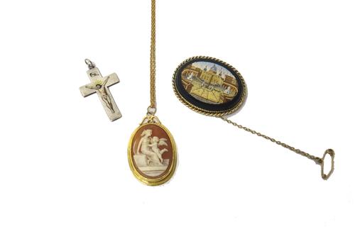 A gold mounted oval micro-mosaic brooch, designed as a view of St Peter's Square, Rome, in a ropetwist wirework border, fitted with a safety chain, a