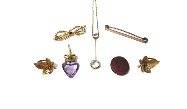 A pale blue gem set pendant necklace, a gold and oval cornelian intaglio ring (damaged), a 9ct gold mounted amethyst pendant, designed as a crown abov