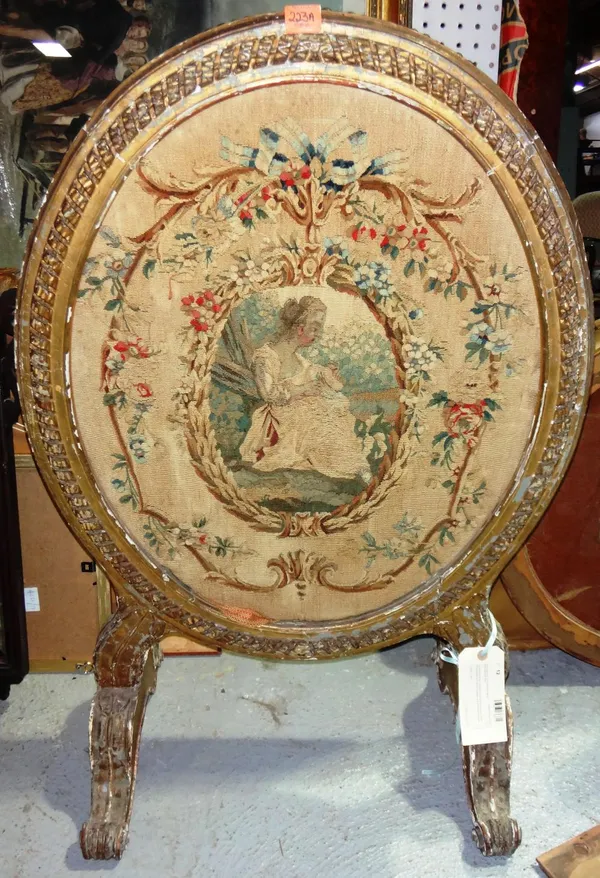 A Louis XVI giltwood oval screen.