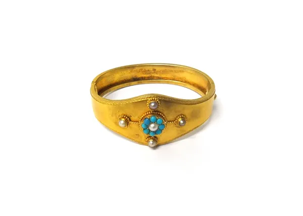 A Victorian gold, turquoise, cultured pearl and gem set oval hinged bangle, the front with a central cluster, having four radiating points terminating