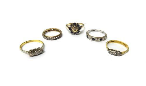 A gold and platinum, diamond set three stone ring, mounted with circular cut diamonds, detailed 18 CT & PLAT, a gold and diamond set three stone ring,