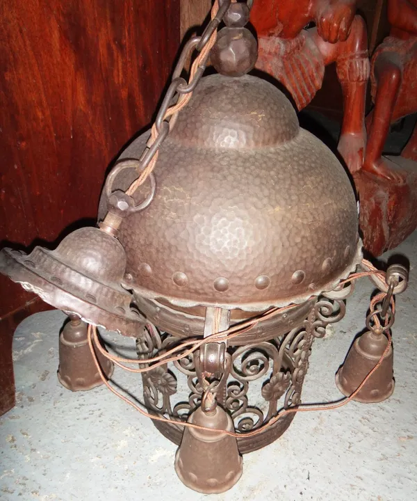 An Arts & Crafts style beaten metal hanging lantern.