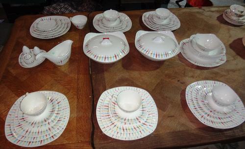 A Midwinter dinner and tea service by Jessie Tait, decorated in the "Cherokee pastel" pattern for approximately six place settings (one breakfast bowl
