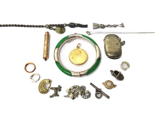 A circular pendant locket, with floral engraved decoration, a propelling pencil, with scroll engraved decoration, a silver vesta case, Birmingham 1901
