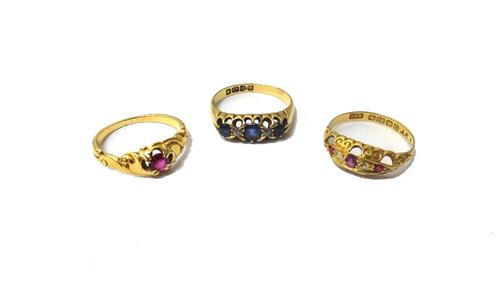 An 18ct gold, sapphire and diamond set five stone ring, mounted with three oval cut sapphires alternating with two cushion shaped diamonds, Chester 19