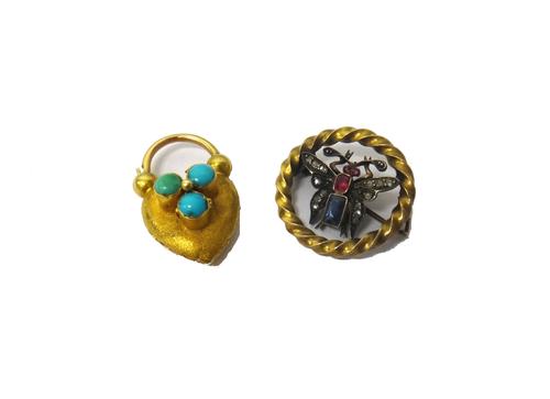 A rose diamond, ruby and sapphire set brooch, designed as a butterfly within a circular ribbon twist surround and a Victorian gold and turquoise set h