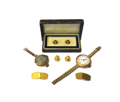 A pair of 9ct gold cufflinks, having barrel shaped backs and fronts, with engine turned decoration, Birmingham 1937, weight 4.6 gms, a pair of  gold d