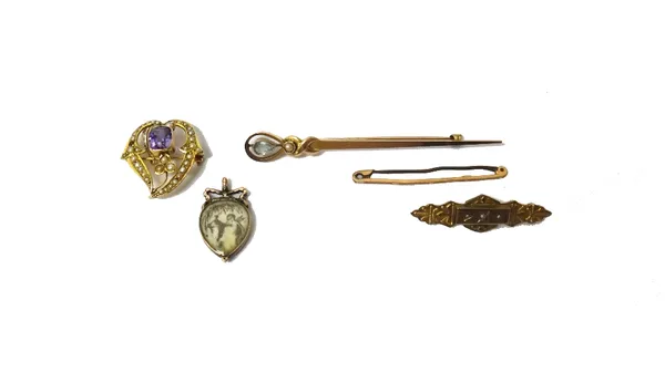 A gold and garnet set glazed pendant locket, with a tied bow surmount, glazed with interwoven hairwork, probably 18th century, a gold, amethyst and se