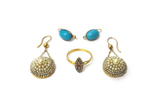 A pair of gold mounted seed pearl set circular earrings, the tops with hook shaped and bead fittings, connected by chains,  a pair of paste imitating