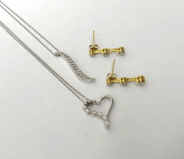 A pair of gold and diamond set three stone earrings, each claw set with a row of graduated circular cut diamonds, the tops with post and butterfly cli