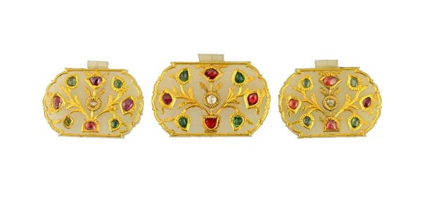 Three gem set jade pendants, North India, 19th century, each of cusped form, with a suspension fitting at the top, the gem set floral motifs centred b