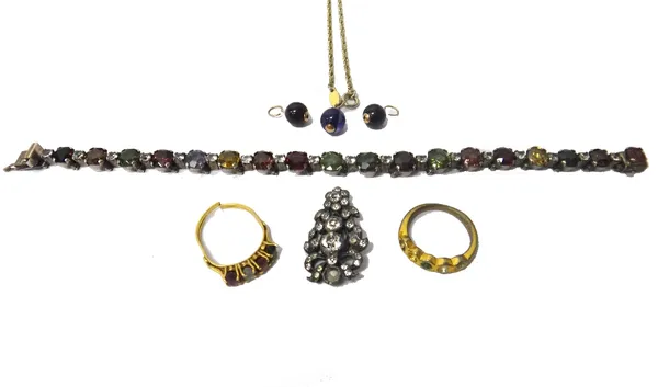 A vary coloured gemstone set bracelet, formed as a row of claw set circular cut coloured gemstones with colourless gem set divisions at intervals, pro