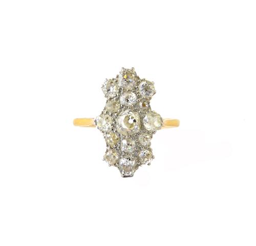 A gold and platinum, diamond set panel shaped cluster ring, mounted with cushion shaped diamonds, detailed 18 CT PT, ring size O.  Illustrated