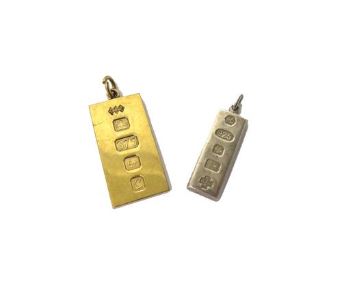 A 9ct gold rectangular ingot shaped pendant, Birmingham 1977, weight  21.7 gms and a silver rectangular ingot shaped pendant, commemorating The Millen