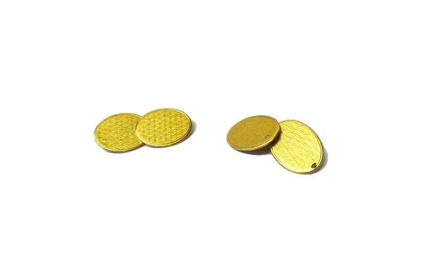 A pair of gold cufflinks,  the oval backs and fronts with engine turned decoration and detailed 18 CT, weight 10.3 gms.