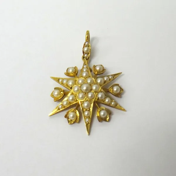 A gold and half pearl set pendant, designed as a six pointed starburst, with six bud shaped motifs at intervals, set throughout with half pearls.