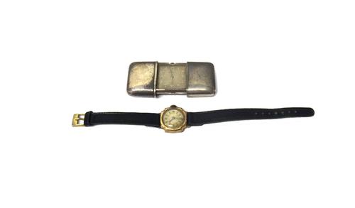 A silver rectangular cased Movado travelling watch, the signed square silvered dial with silvered Arabic numerals, the case detailed 0.935, Swiss Made