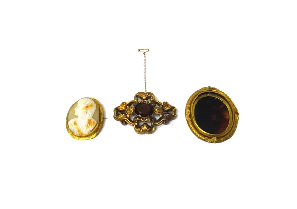 A gold mounted oval shell cameo brooch, carved as the portrait of a lady, a gold oval brooch mount, decorated with a wirework border and having a tort