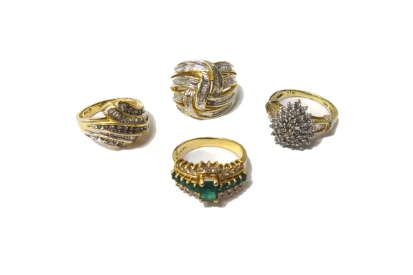 A gold, emerald and diamond set ring, claw set with the principal rectangular cut emerald at the centre, between two rows of five square cut emeralds