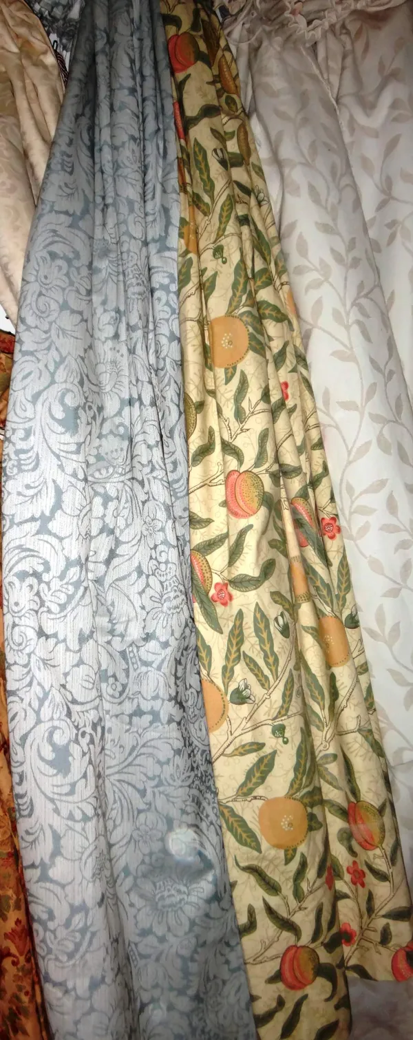 A pair of yellow floral curtains decorated with fruit, each curtain 80cm wide x 180cm long, together with a pair of blue floral curtains, each curtain