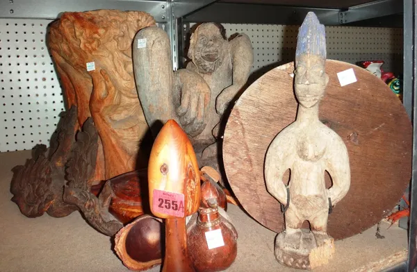 A quantity of carved wooden items, including tribal style figures, wooden ducks and sundry.