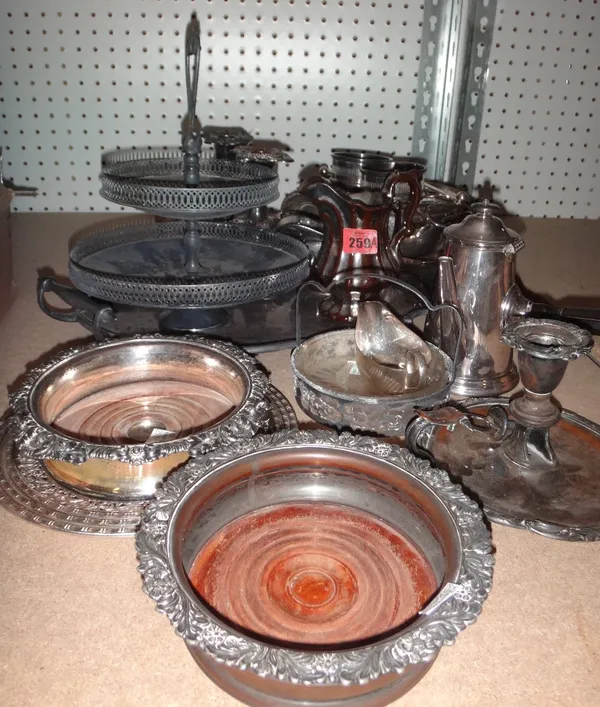A quantity of plated wares, including a twin handled tray, bottle coasters, candlesticks and sundry.