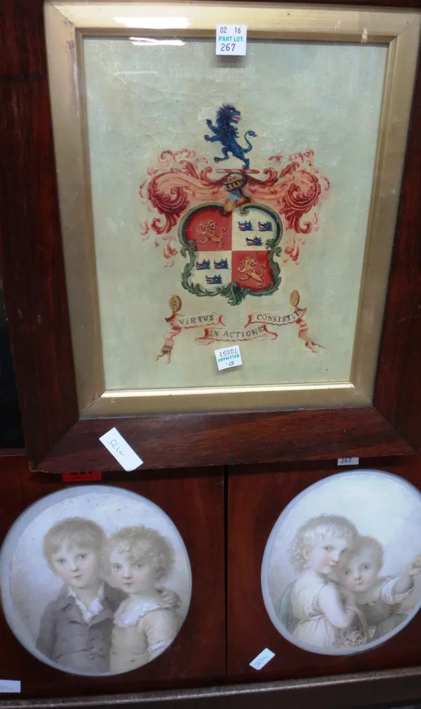 English School (19th century), Studies of children, a pair, oval, watercolour, possibly over an engraved base; together with an oil of a heraldic embl