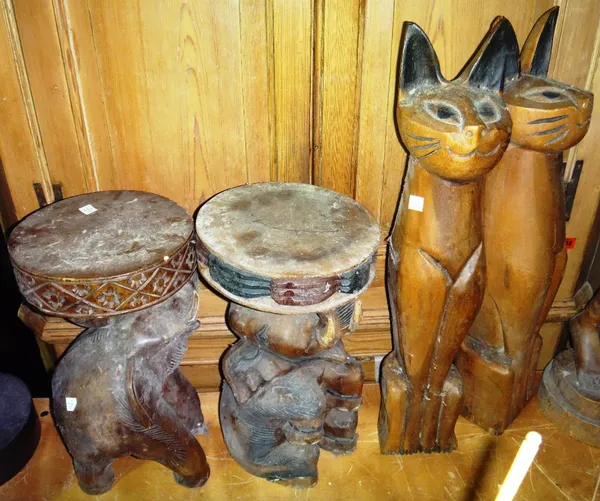 A pair of hardwood carved elephant stools and two hardwood carved cats.