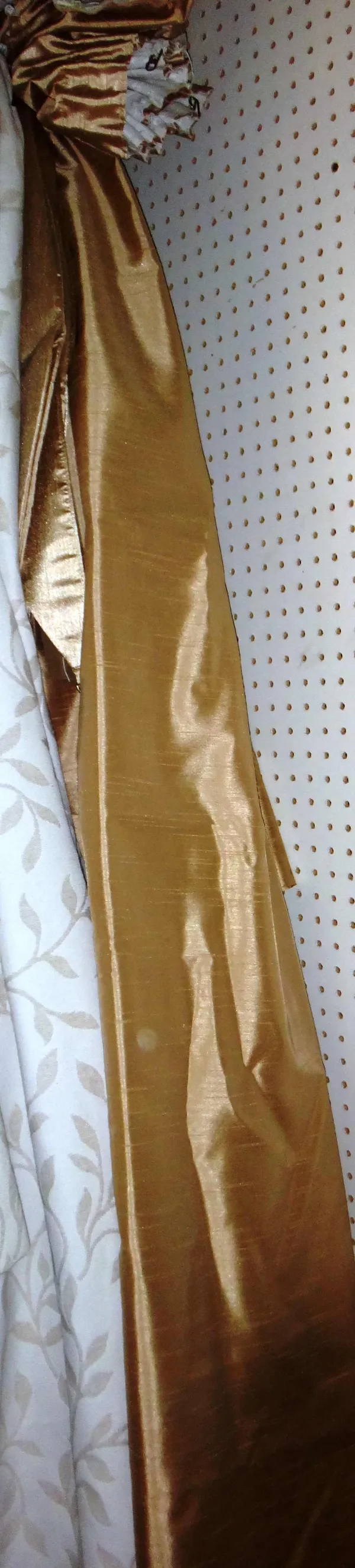A quantity of modern gold silk curtains.