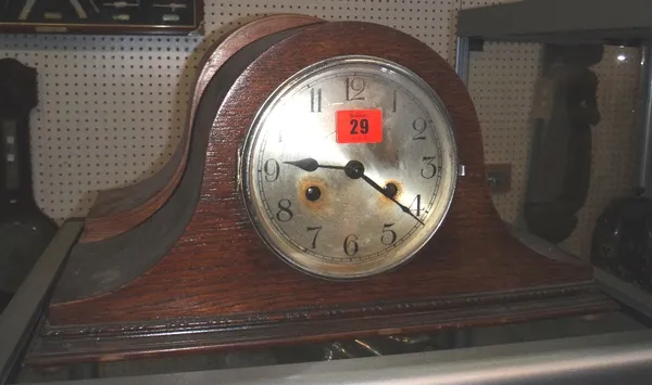A similar pair of 20th century oak mantel clocks and a wall barometer.