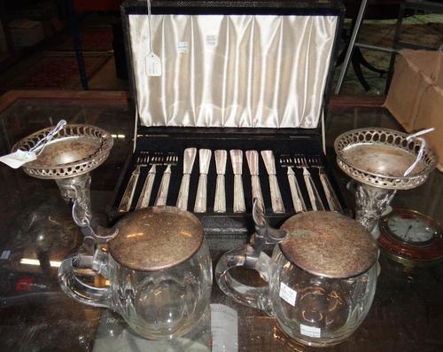 A pair of Eastern vases, decorated with Deity figures within pierced rims, probably Indian, a pair of silver plated metal mounted glass hinge lidded m