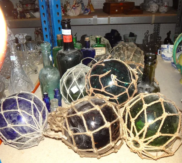 A quantity of 19th century and later glass, including bottles, nautical glass floats and sundry.