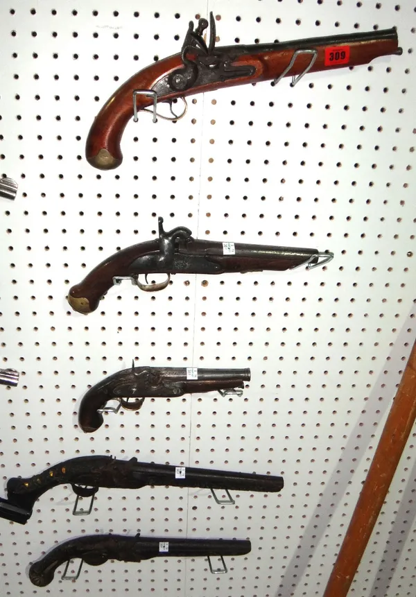A group of five flintlock and percussion action pistols.