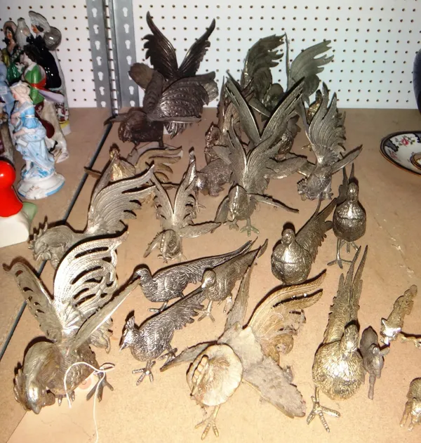 A large quantity of silver plated models of birds.
