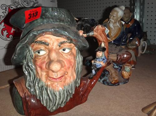 A Royal Doulton character jug 'Rip Van Winkle', together with three Oriental ceramic figures and a pair of transfer painted cups.