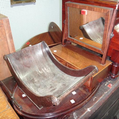A 19th century mahogany swing framed toilet mirror, together with an oval mahogany twin handled tray and a mahogany cheese coaster.