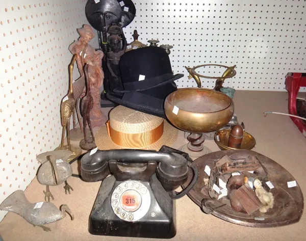 A quantity of collectables, including a Bakelite telephone, two bowler hats, a boater,  tribal figures, copper and brass items and sundry.