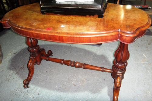 A Victorian walnut centre table.