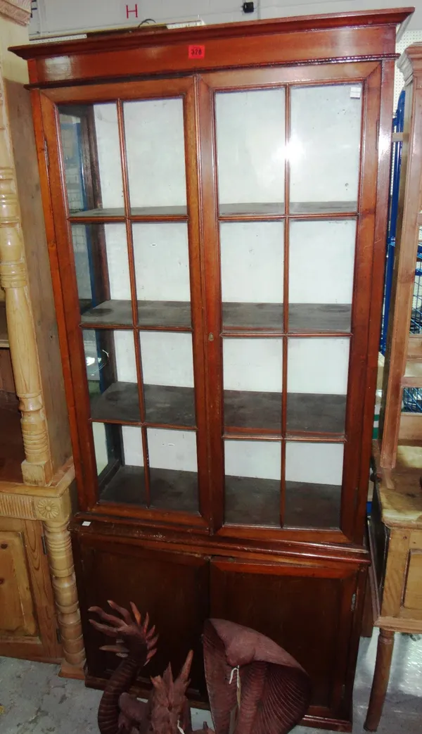 A mahogany glazed bookcase.